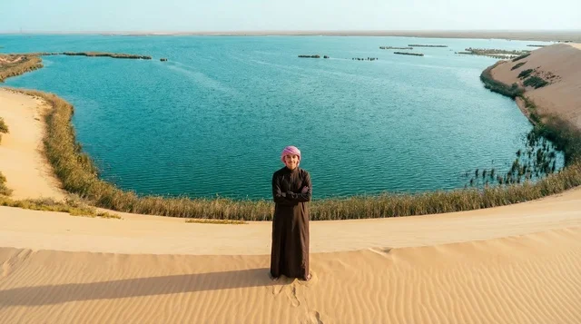 Saudi Man in Traditional Dress at Al-Asfar Desert Lake