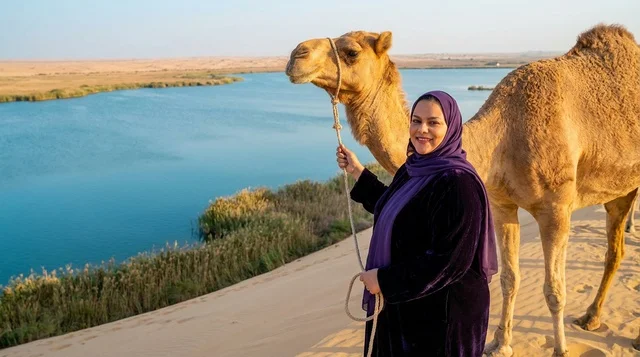 Saudi Woman with Camel at Desert Lake Oasis