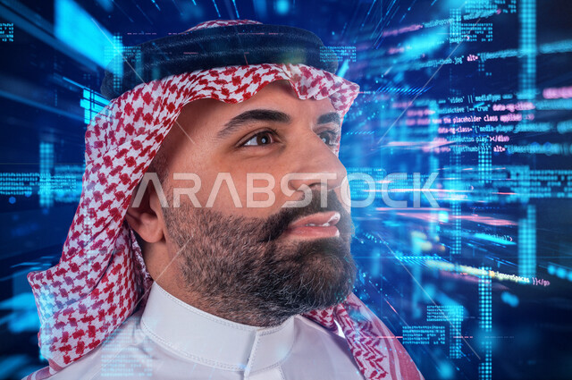 A Saudi Arabian Gulf man aspires to achieve a better future vision, standing in front of a screen containing a programming language with hologram technology with gestures indicating focus and aspiration, keeping pace with modernity and technological devel