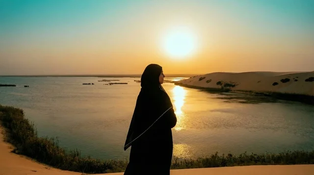 Saudi Woman in Black Abaya at Desert Lake Sunset