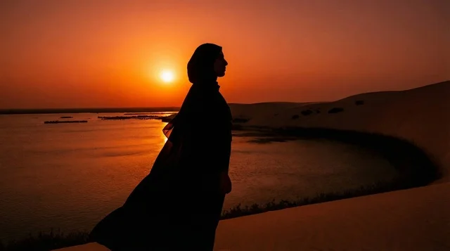 Emirati Woman Silhouette in Desert Sunset