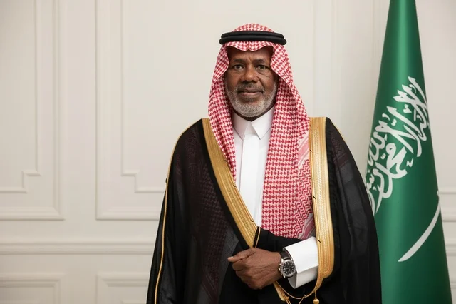 Saudi Man in Traditional Bisht with National Flag