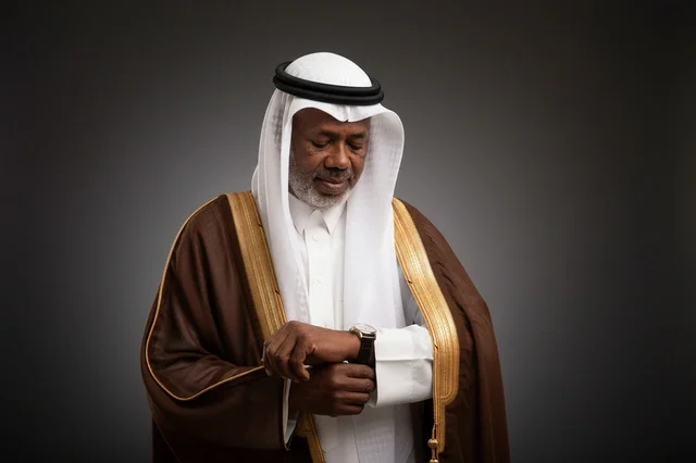 Saudi Senior Man in Traditional Bisht Checking Watch