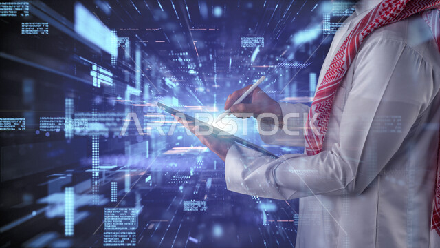 رجل عربي خليجي سعودي يحمل جهاز تقني ( تابلت ) و قلم للكتابة مدموجة بشاشة خاصة باللغات البرمجية بخاصية الهولوجرام ثلاثية الابعاد ، وظيفة مطور ويب ، استخدام لغات البرمجة و تطوير المواقع و التطبيقات الالكترونية