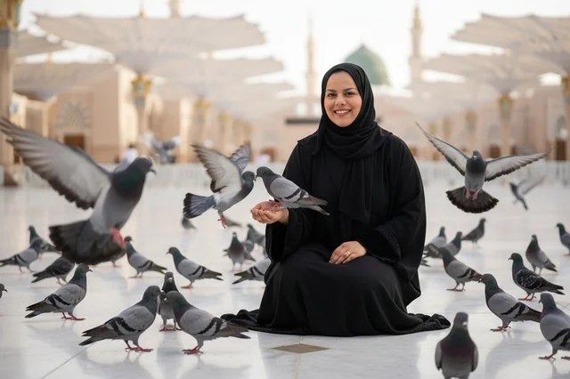 امرأة سعودية مع الحمام في المسجد النبوي بالمدينة المنورة
