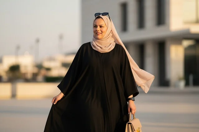 Emirati Woman in Black Abaya and Beige Hijab