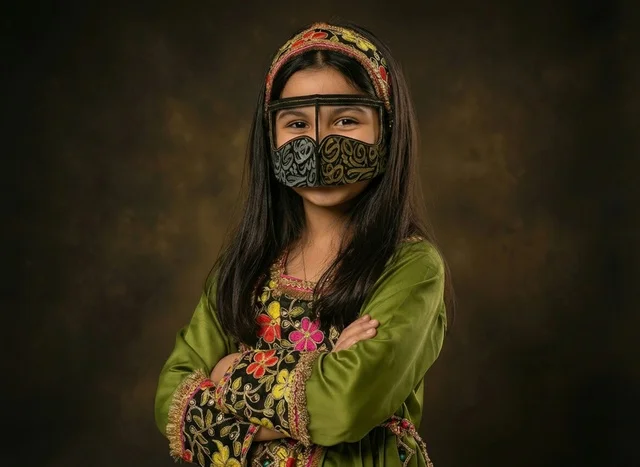 Emirati Girl in Traditional Dress and Burqa