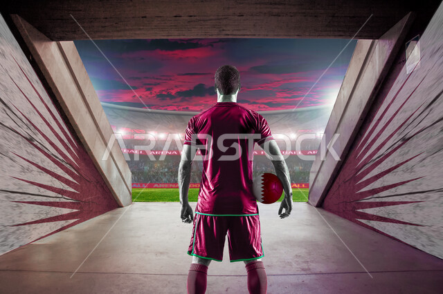  صوره من الخلف للاعب قطري خليجي يرتدي زي فريق كرة القدم القطري  يمسك بيده كرة قدم ملونه بألوان العلم القطري, بطولة كأس العالم 2022 في قطر, نهائيات كأس العالم 2022, كاس العالم FIFA, مونديال قطر, تشجيع الفريق القطري لكرة القدم, الشغف بكرة القدم, أنديه وتشجي