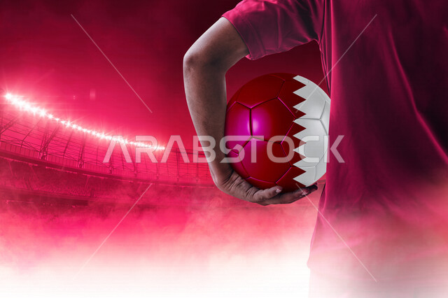 A picture from the back of a Qatari Gulf player wearing the Qatari football team uniform, holding a hand colored football in the colors of the Qatari flag, 2022 World Cup in Qatar, 2022 World Cup Finals, FIFA World Cup, Qatar World Cup, encouraging the Qa