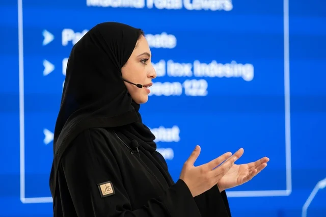 An Emirati businesswoman speaks at a professional conference.