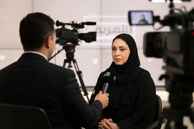 Emirati Woman in Abaya During TV Studio Interview