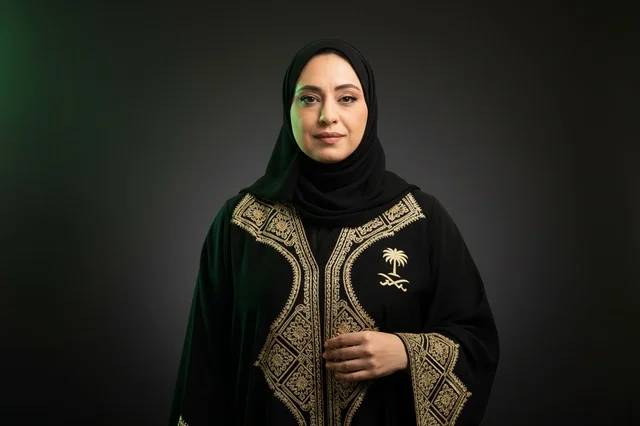 Saudi Woman in Traditional Gold Embroidered Abaya