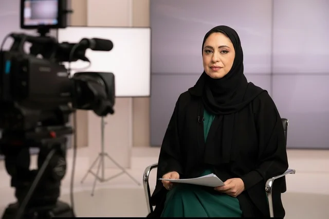 Saudi Female News Anchor in Television Studio