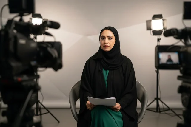 Emirati Female News Anchor in Television Studio