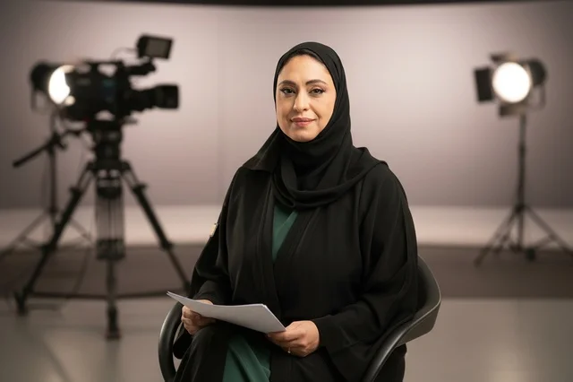 Emirati Female News Anchor in Television Studio