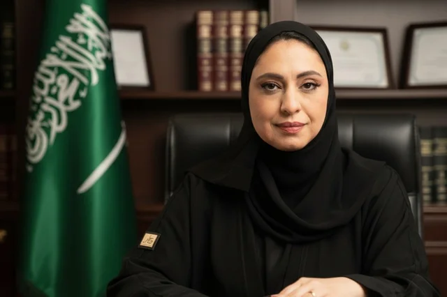 Professional Saudi Woman in Abaya with Flag