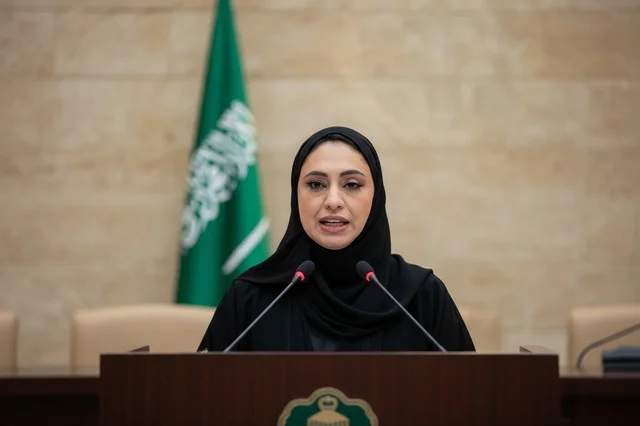 Saudi Woman Official Speech at Podium with Flag