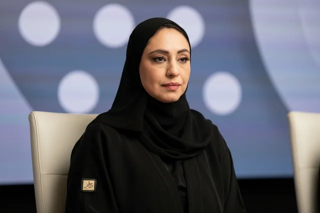 Saudi Woman in Traditional Black Abaya at Formal Meeting