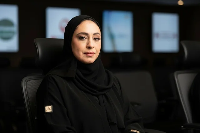 Emirati Businesswoman in Black Abaya in Modern Office