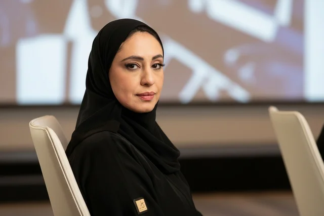 Emirati Businesswoman in Black Abaya in Office