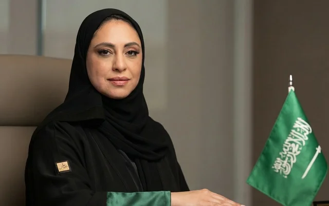 Saudi Businesswoman in Abaya with National Flag