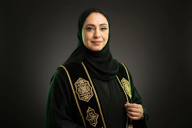 Saudi Woman in Traditional Green Embroidered Bisht