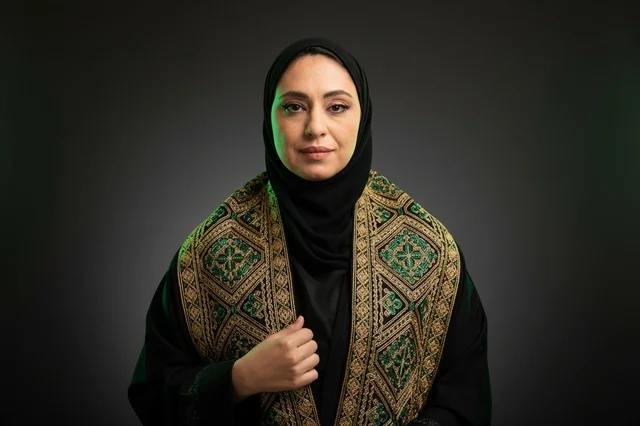 Saudi Woman in Traditional Embroidered Abaya and Bisht