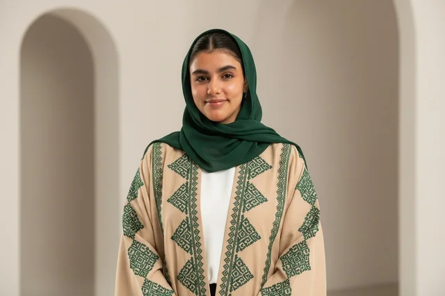 Saudi Woman in Beige Embroidered Abaya and Hijab