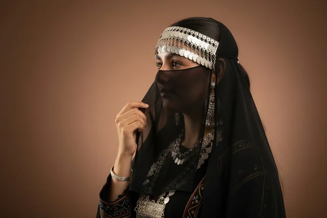Saudi Woman in Traditional Bedouin Attire and Silver Jewelry