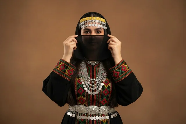 Palestinian Woman in Traditional Thobe and Silver Jewelry
