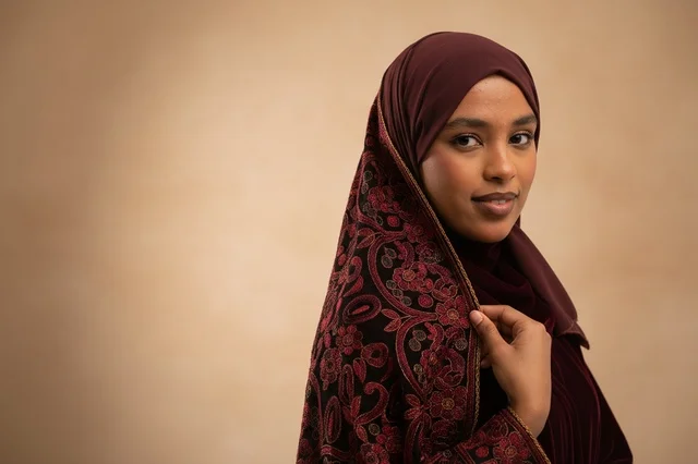 Somali Woman in Burgundy Hijab and Embroidered Shawl