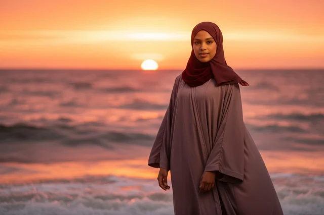 Muslim Woman in Hijab on Beach at Sunset