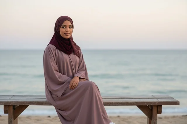 Somali Woman in Abaya Sitting on Beach Bench