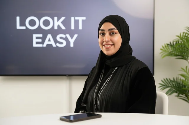 Saudi Woman in Black Abaya Sitting in Modern Office