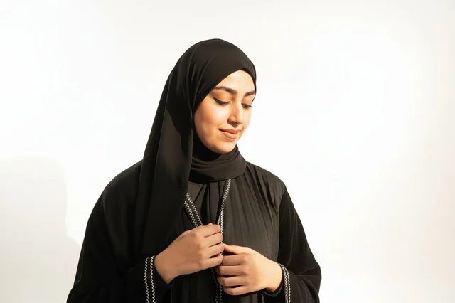 Emirati Woman in Black Abaya on White Background