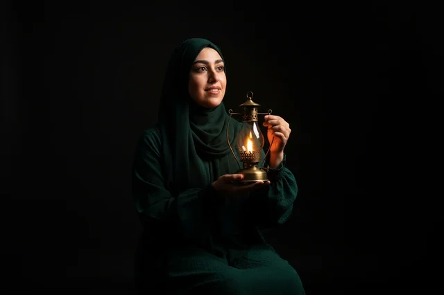 Muslim Woman Holding a Lit Ramadan Lantern in Studio
