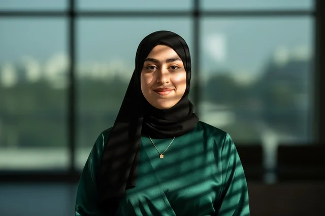 Emirati Woman in Hijab with Window Blind Shadows