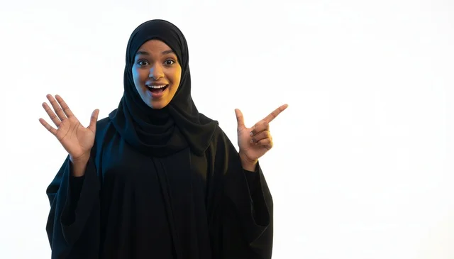 Surprised Saudi Woman in Abaya Pointing on White Background