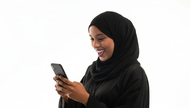 Saudi Woman in Abaya Using Smartphone on White Background
