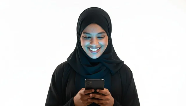 African Woman in Black Hijab Using Smartphone