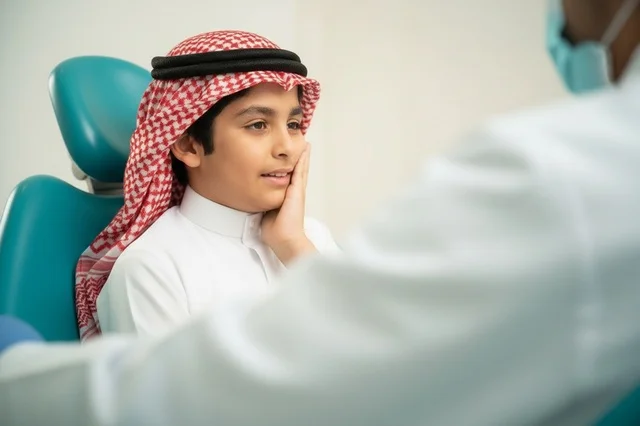 Saudi Boy with Toothache at Dental Clinic Saudi Boy with Toothache at Dental Clinic