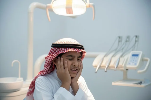 Saudi Boy with Toothache in Dental Clinic