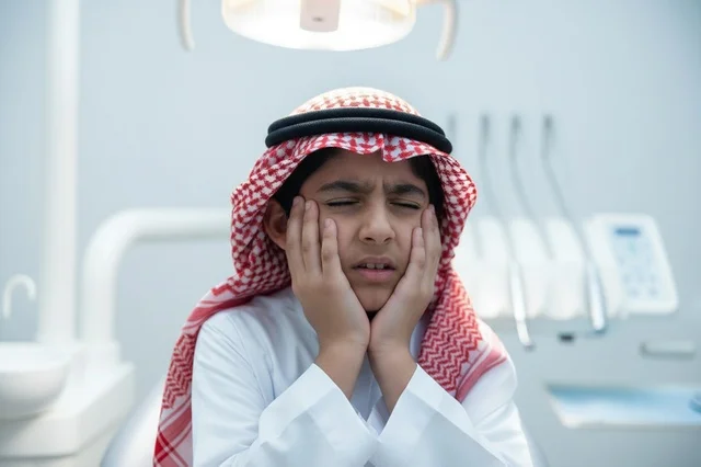 Saudi Boy with Toothache Pain in Dental Clinic