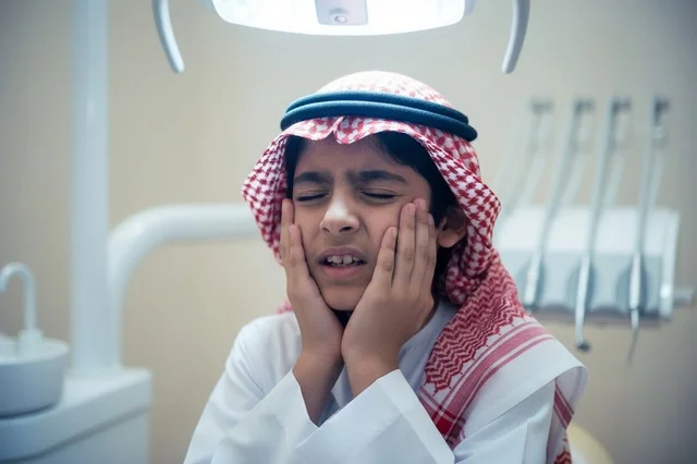 Saudi Boy with Toothache at Dental Clinic