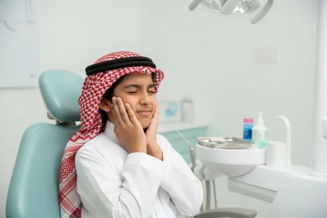 Saudi Boy with Toothache at Dentist Clinic