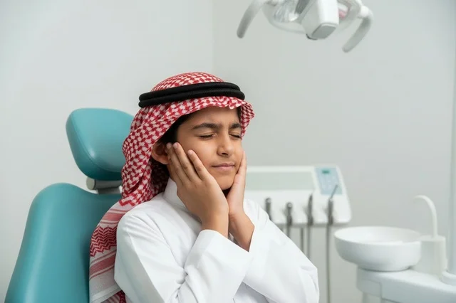 Saudi Boy with Toothache in Dentist Clinic