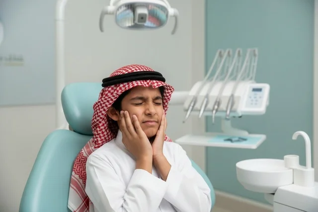 Saudi Boy with Toothache in Dental Clinic Healthcare