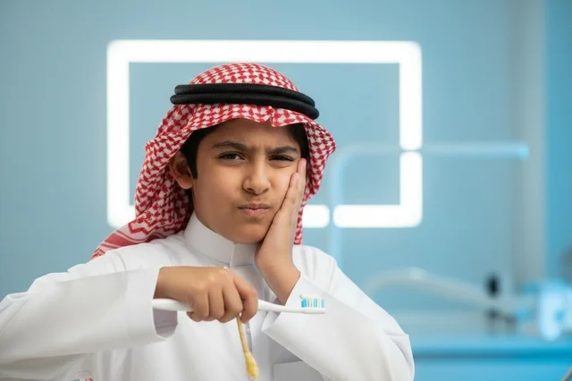 Saudi Boy with Toothache in Dental Clinic