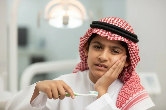 Saudi Boy with Toothache in Dental Clinic