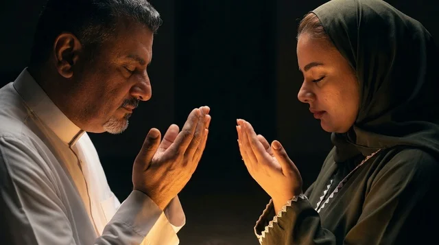 Arab Couple Praying in Traditional Dress Supplication